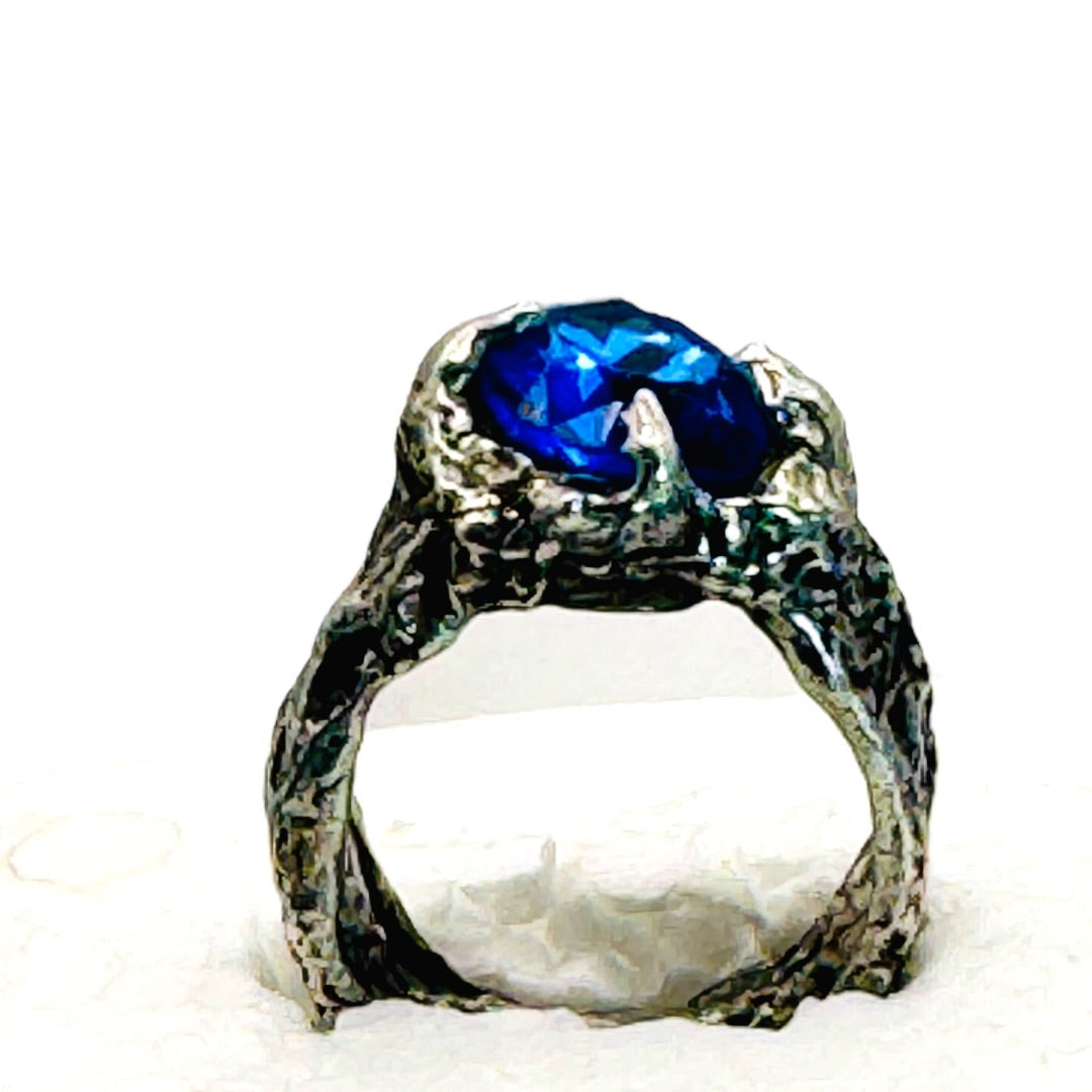 Brutalist Style Silver Blend Metalwork Ring With 10mm Cushion Blue Crystal Stone