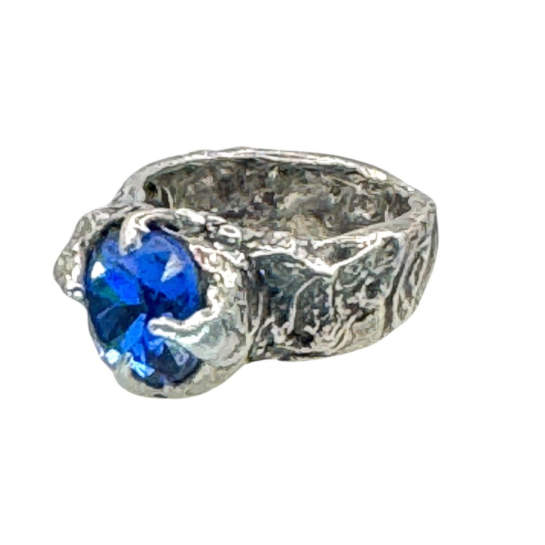 Brutalist Style Silver Blend Metalwork Ring With 10mm Cushion Blue Crystal Stone