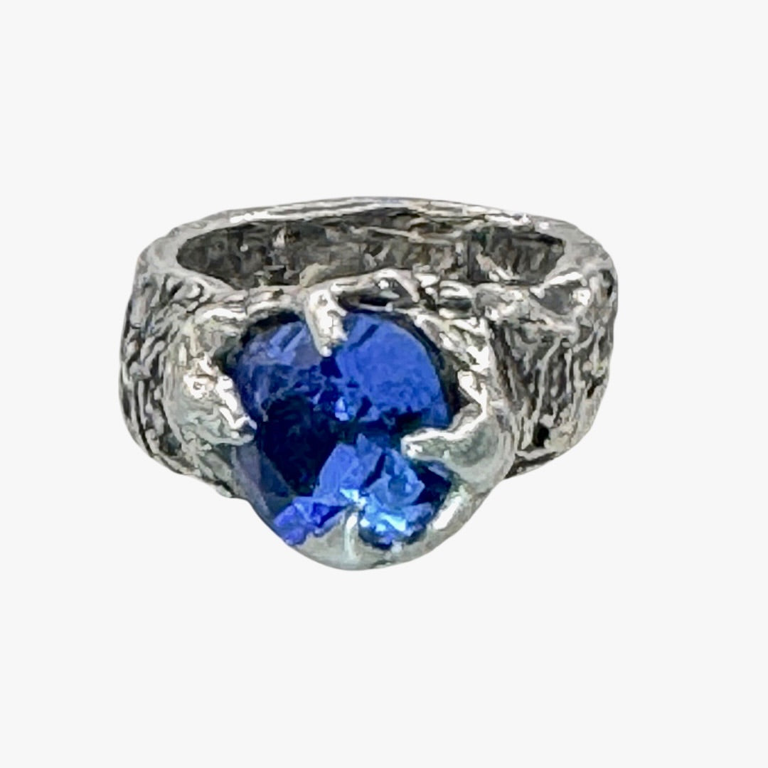 Brutalist Style Silver Blend Metalwork Ring With 10mm Cushion Blue Crystal Stone