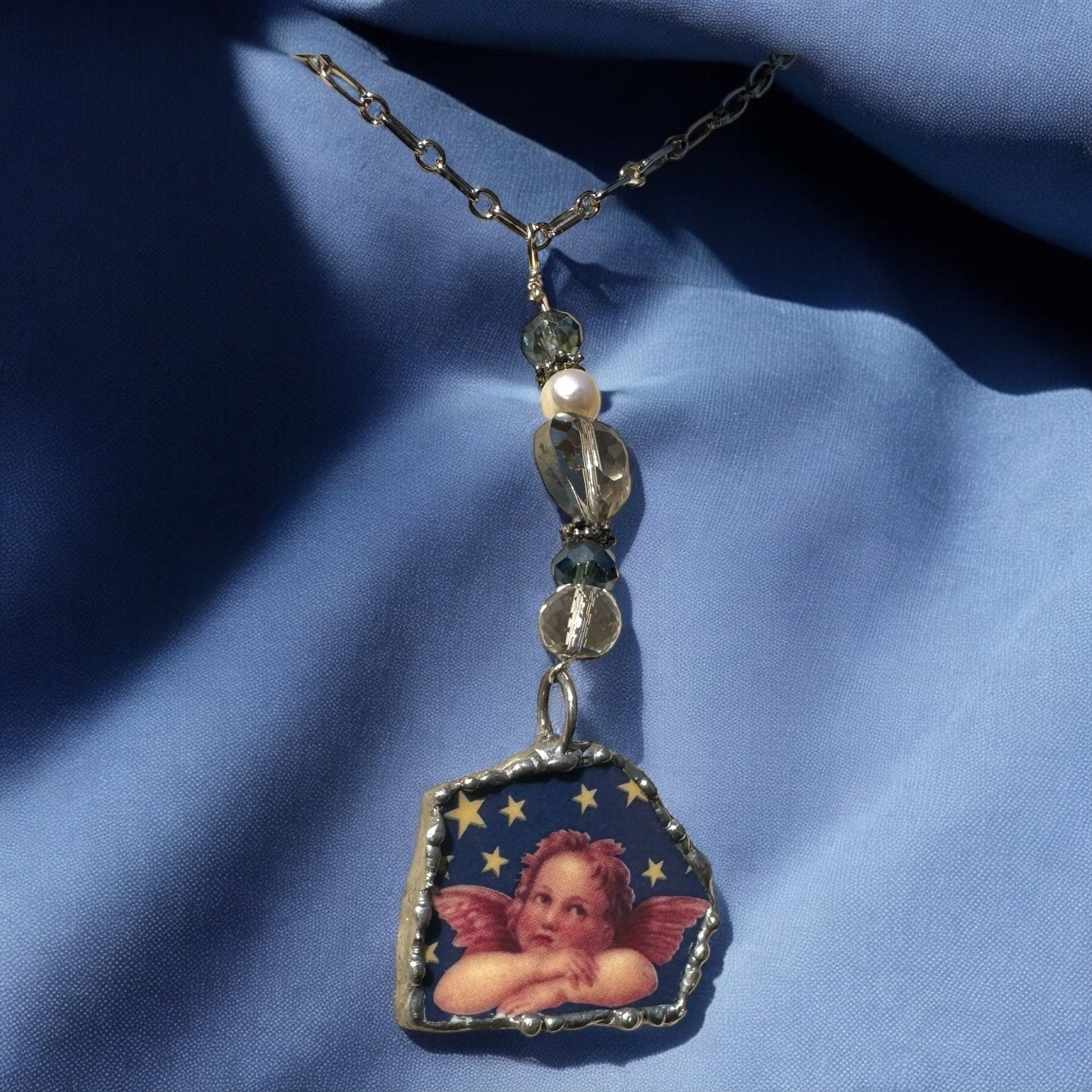 Cherub Broken China Pendant Caged in Silver Blend Bezel & Crystal Beads