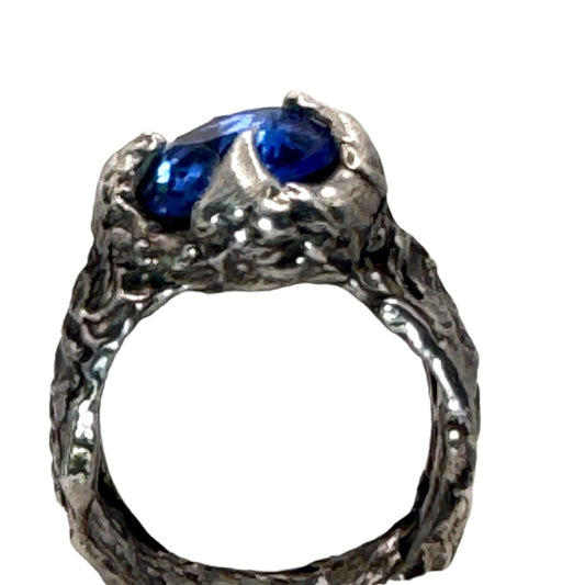 Brutalist Style Silver Blend Metalwork Ring With 10mm Cushion Blue Crystal Stone