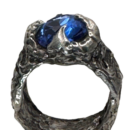 Brutalist Style Silver Blend Metalwork Ring With 10mm Cushion Blue Crystal Stone